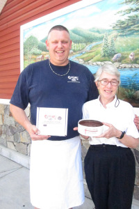 Joq Quintal of Oscar’s and Sister Cecilia of Nuns of New Skete with the new Chocolate Bacon Cheesecake.