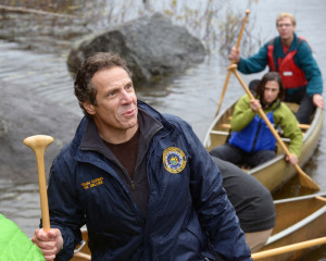Proven men of muscular might Russian president Vladimir Putin, left, & Adirondack paddler Andrew Cuomo (note that’s ex-Chronicle intern Jimmy Vielkind and Liz Benjamin in the canoe vs. the governor). 