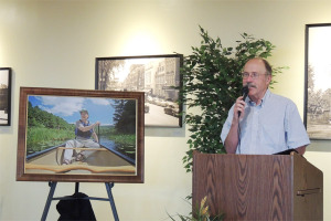 Dr. Daniel Larson beside the Dr. John Rugge photo that will be placed in the new Warrensburg Health Center that will bear Dr. Rugge’s name. Chronicle photo/Gordon Woodworth