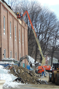 A Rozell Industries crew works to seal up the portion of the back wall of the Glens Falls Civic Center on Monday, March 8. Chronicle photo/Gordon Woodworth