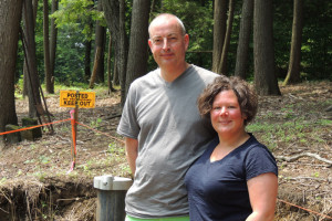 Steve & Jennifer Kitchen on their Assembly Point lot in the summer of 2013 — in front of the well they had drilled and the “No Trespassing” sign at the edge of George Hearst’s property.  Chronicle file photo/Gordon Woodworth