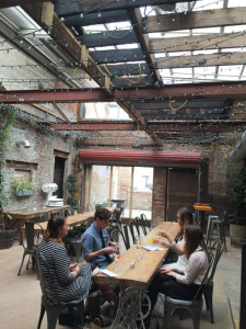 The Garden in-between The Confectionery and Peck’s Arcade is a year-round space. Here, in cool weather, the clear roof was still on and the space heated. In warm weather, the roof is off. 