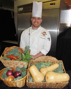 Dunham’s Bay Chef AJ Richards, in his kitchen with local vegetables. Chronicle photo/David Cederstrom