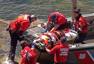 Karen Ross and her friend both suffered broken backs. Here they were loaded onto a Coast Guard boat and transported to the hospital. Photo by Wayne Savage