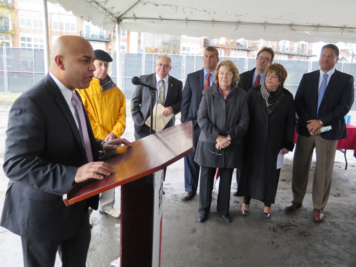 Omar Usmani, at the podium, addressed the ground-breaking ceremony last month for 14 Hudson LLC, the 5-story, $25-million apartment/retail/business complex being developed by Sonny Bonacio and The Galesi Group just east of Glens Falls Hospital.   
