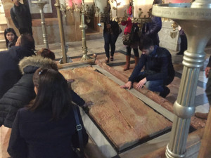 At the Church of the Holy Sepulcher — Jesus’s body after crucifixion is said to have been prepared for burial on this stone.  Chronicle photo/Mark Frost