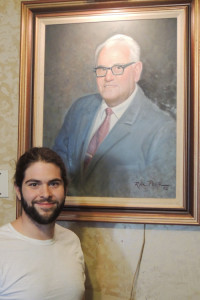 New Massie’s owner Jonathan Greenwood, in front of a painting of Ralph “Massie” Russo, who ran the restaurant for more than 60 years until his death in 1992. Chronicle photo/Gordon Woodworth