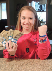 Freshman Kassi Cook saved her tips from her job at Mr. Bill’s, and is selling bracelets to raise money for the South High Marathon Dance. Chronicle photo/Gordon Woodworth