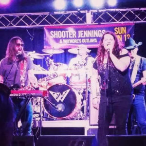 Katy Cole joined Waymore’s Outlaws on stage, earlier this month at a club in Warrendale, Pennsylvania. Frontman Shooter Jennings — Waylon’s son — is far left. Ms. Cole is featured on his newest album.