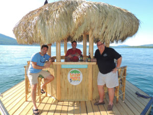 Enjoying their floating Tiki bar, from left, Greg Teresi, Frank Casimo and Larry Davis. Chronicle photos/Gordon Woodworth