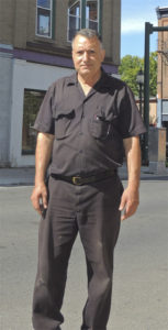 Peter Shabat owns several buildings on South Street, including 46-56 South Street behind him. The three-story building is seen as a potential anchor of South Street’s revitalization. Chronicle photo/Gordon Woodworth