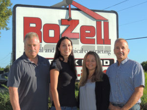 The founders of Rozell Industries were Brian Rozell (left), his brother Peter, now retired, and their late father Peter Rozell Sr. Today Brian is president, and his brother Mike (right) is secretary. Brian’s daughter Tiarra Guidon (second from left) is vice president and Mike’s daughter Jen Whalen is treasurer. The women are also majority owners of a separate division, Rozell North. Their husbands also work in the business. 