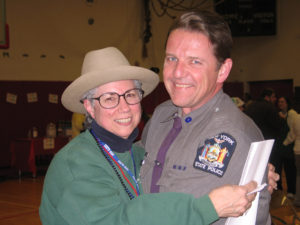 At the Marathon Dance - Tim Pratt was always there, providing security, hobnobbing with friends, like Karen Carayiannis, his third-grade teacher at Harrison Avenue Elementary School, modeling Tim’s hat. Chronicle photo/Gordon Woodworth  