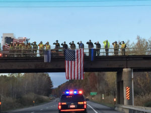 As the procession carrying Trooper Tim Pratt’s body made its way up the Northway, it was greeted at every overpass by those paying their respects. Photo by a Trooper friend of Tim Pratt’s